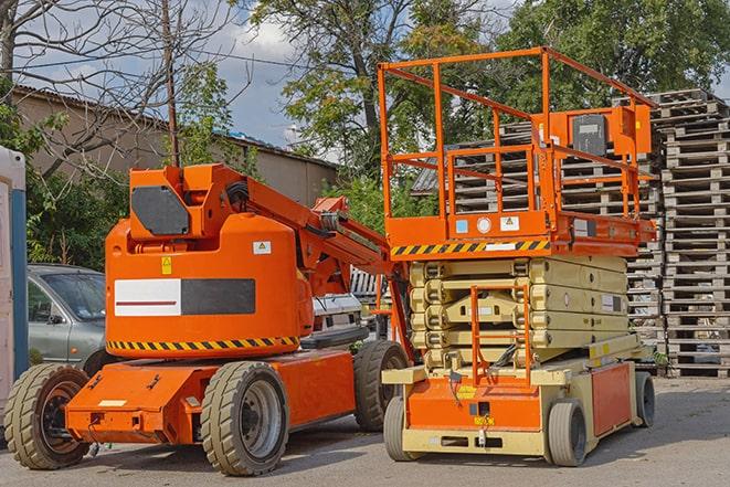 forklift moving pallets of inventory in a warehouse in Aventura